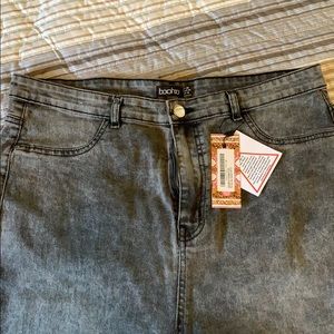 Grey acid wash jeans.